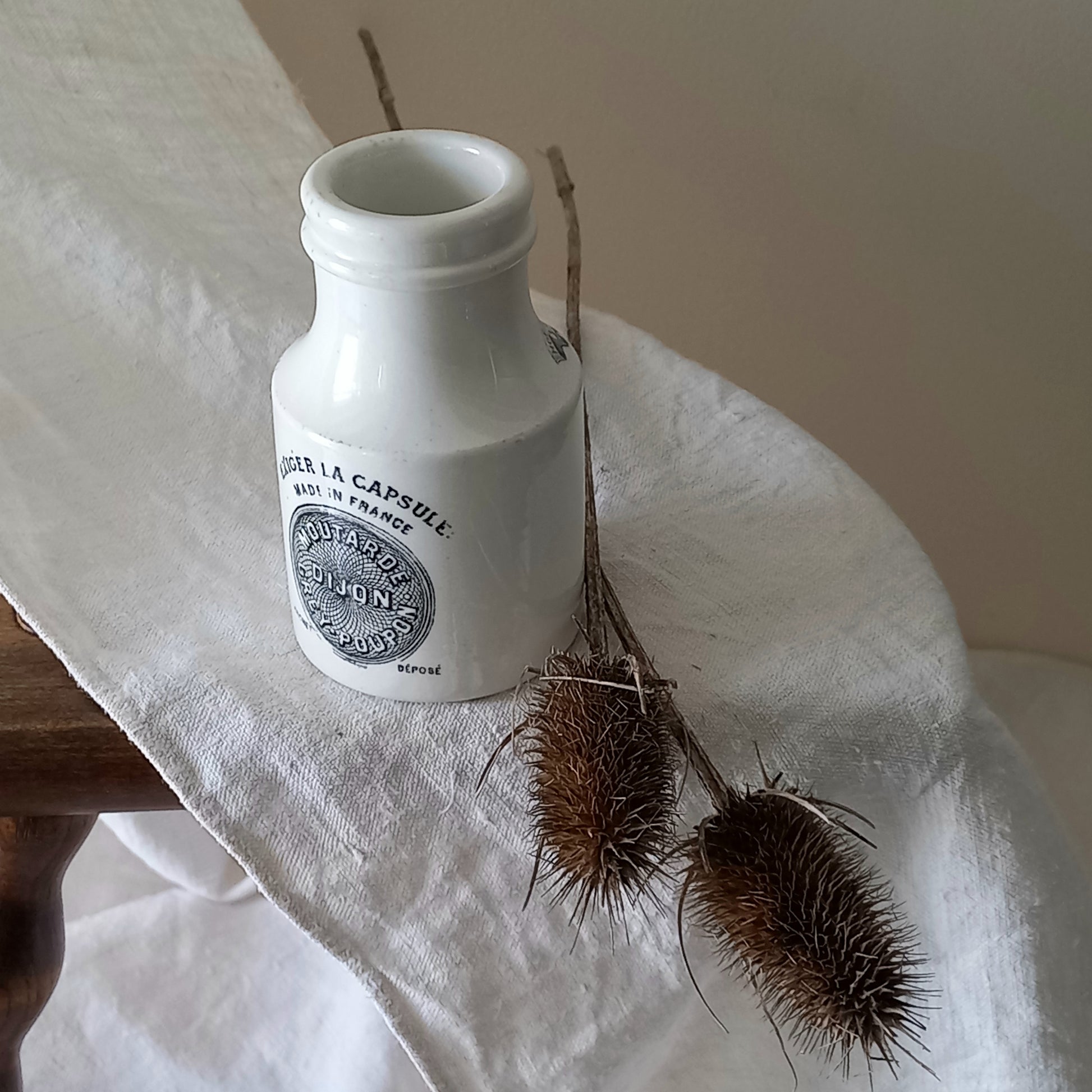 A small antique white ironstone Dijon Grey-Poupon mustard pot made by premier French manufacturer Sarreguemines. These little pots are very collectible and make wonderful pieces of home decor.