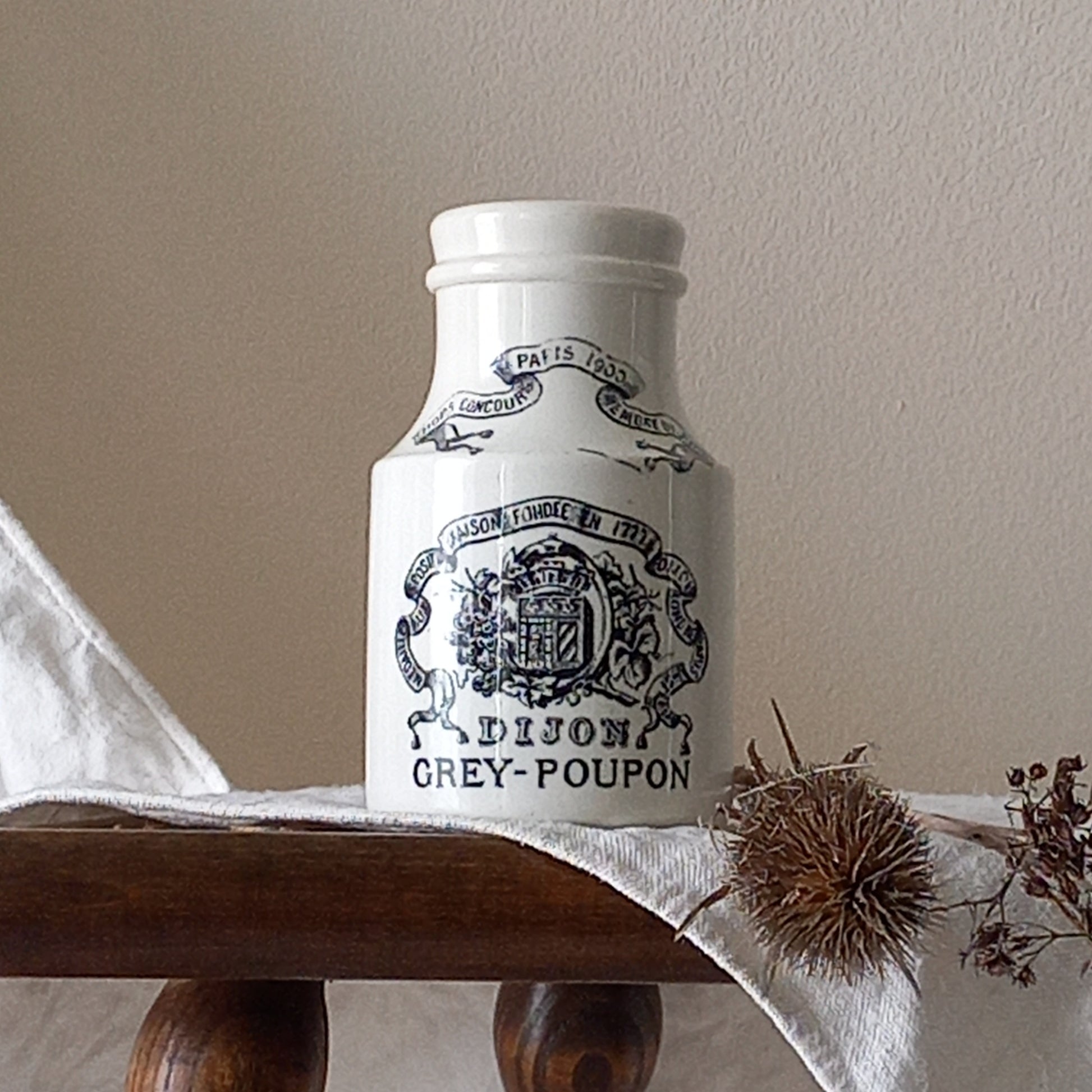 A small antique white ironstone Dijon Grey-Poupon mustard pot made by premier French manufacturer Sarreguemines. These little pots are very collectible and make wonderful pieces of home decor.