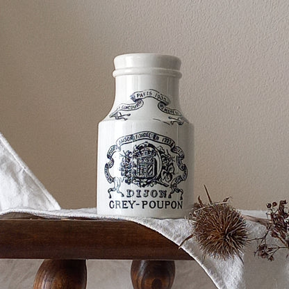 A small antique white ironstone Dijon Grey-Poupon mustard pot made by premier French manufacturer Sarreguemines. These little pots are very collectible and make wonderful pieces of home decor.