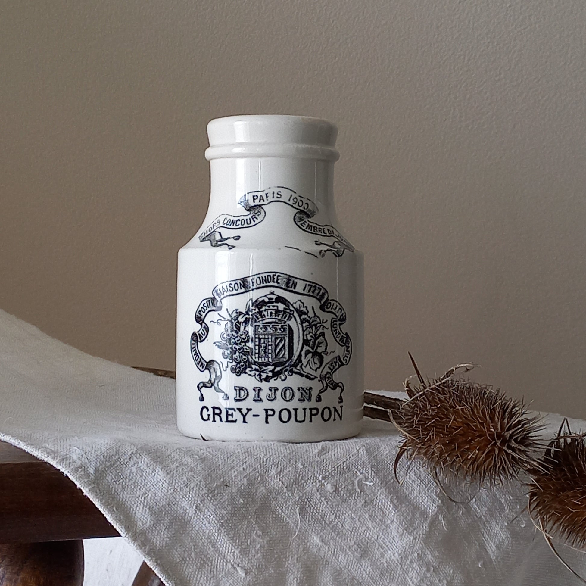 A small antique white ironstone Dijon Grey-Poupon mustard pot made by premier French manufacturer Sarreguemines. These little pots are very collectible and make wonderful pieces of home decor.