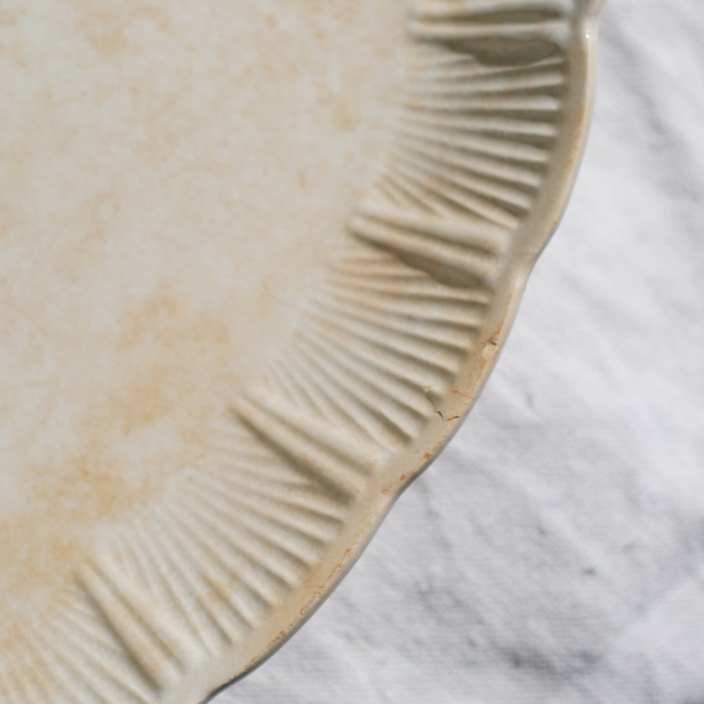 A beautiful pair of French antique ironstone raviers or side plates which over the last century or more have developed a wonderful time-worn and tea-stained finish which make them perfect for shabby chic interior decor. We very rarely come across these little plates lately they're a rare find.