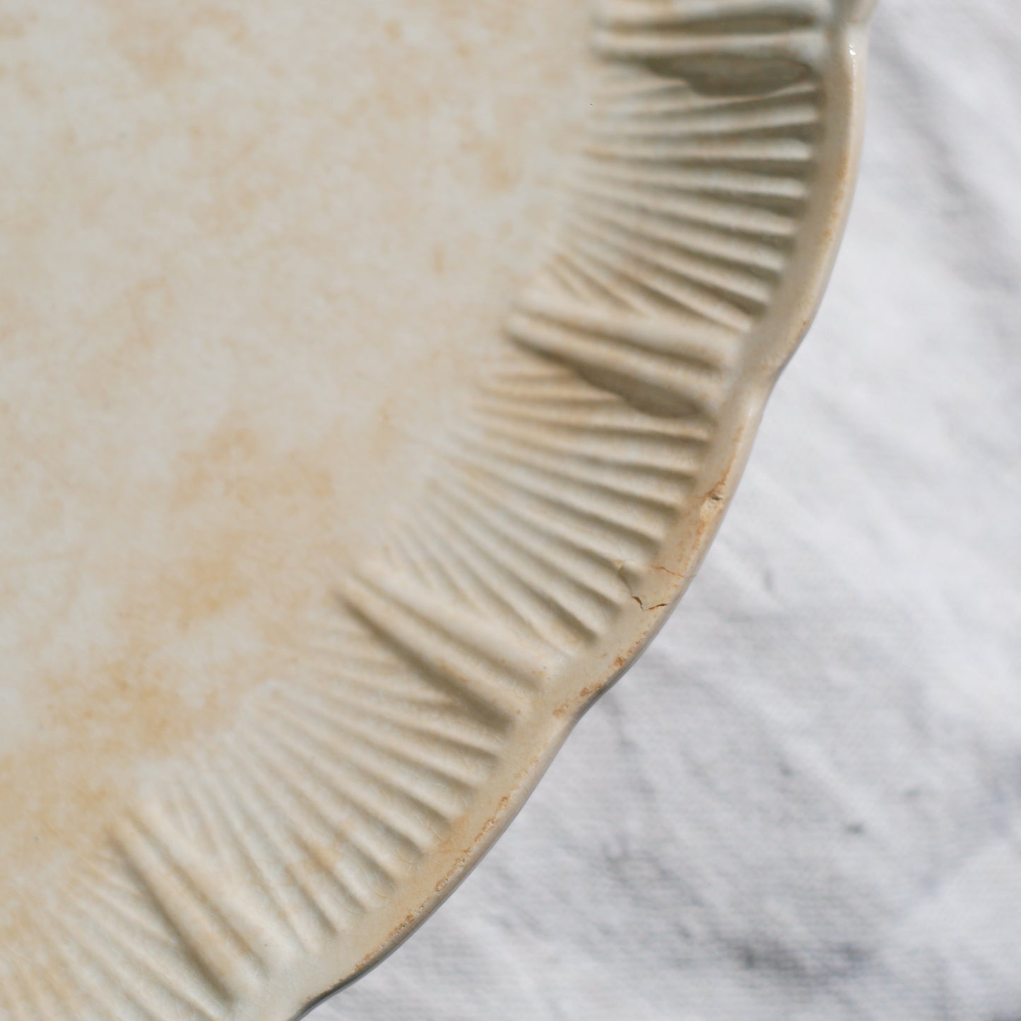 A beautiful pair of French antique ironstone raviers or side plates which over the last century or more have developed a wonderful time-worn and tea-stained finish which make them perfect for shabby chic interior decor. We very rarely come across these little plates lately they're a rare find.