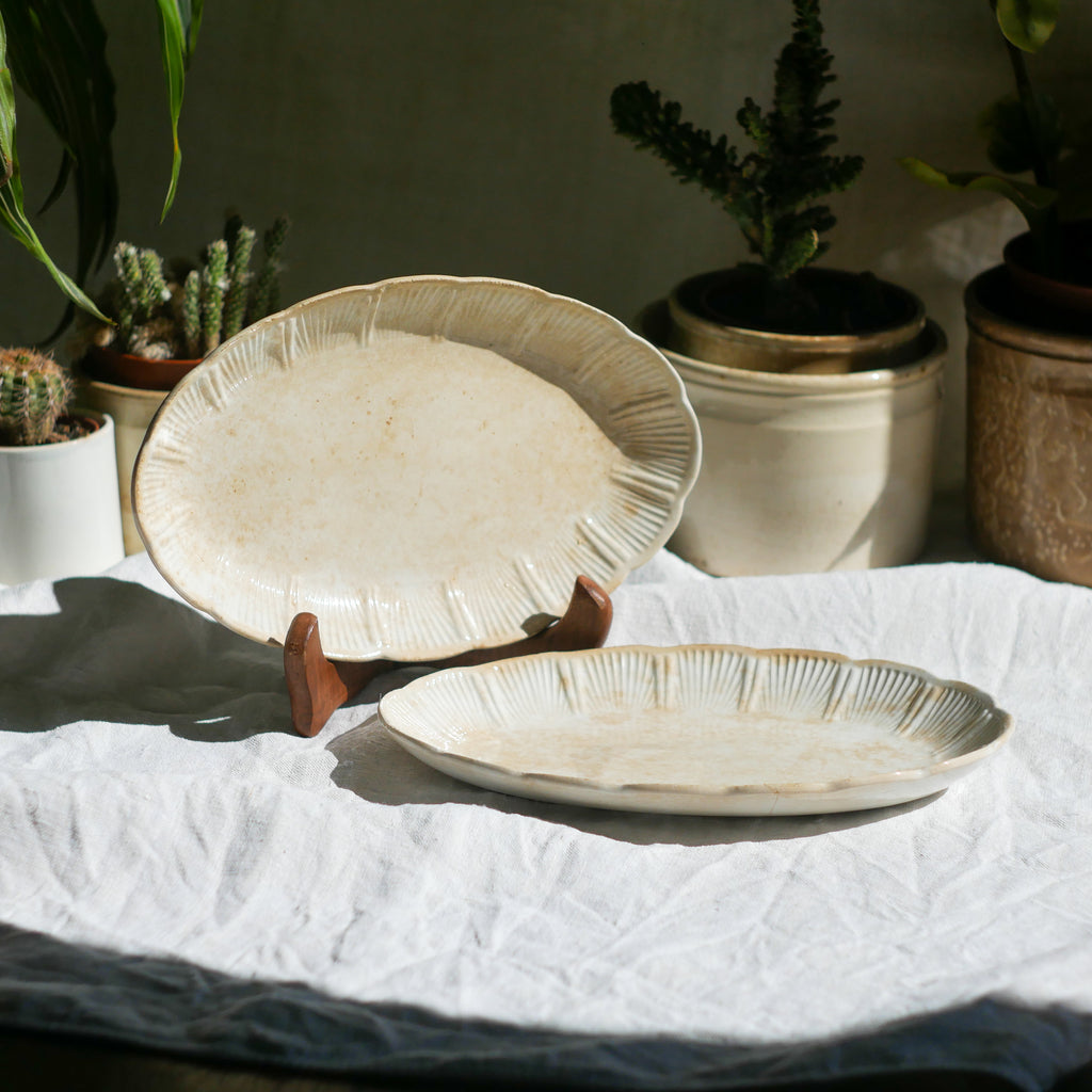 A beautiful pair of French antique ironstone raviers or side plates which over the last century or more have developed a wonderful time-worn and tea-stained finish which make them perfect for shabby chic interior decor. We very rarely come across these little plates lately they're a rare find.