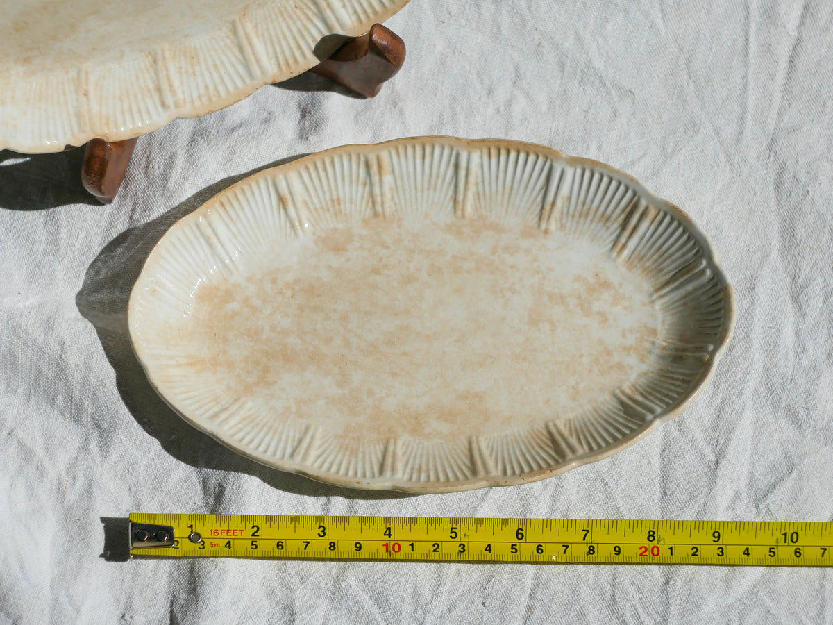 A beautiful pair of French antique ironstone raviers or side plates which over the last century or more have developed a wonderful time-worn and tea-stained finish which make them perfect for shabby chic interior decor. We very rarely come across these little plates lately they're a rare find.