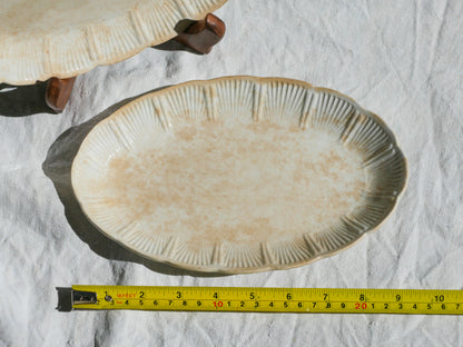 A beautiful pair of French antique ironstone raviers or side plates which over the last century or more have developed a wonderful time-worn and tea-stained finish which make them perfect for shabby chic interior decor. We very rarely come across these little plates lately they're a rare find.