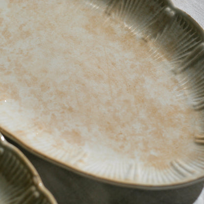 A beautiful pair of French antique ironstone raviers or side plates which over the last century or more have developed a wonderful time-worn and tea-stained finish which make them perfect for shabby chic interior decor. We very rarely come across these little plates lately they're a rare find.