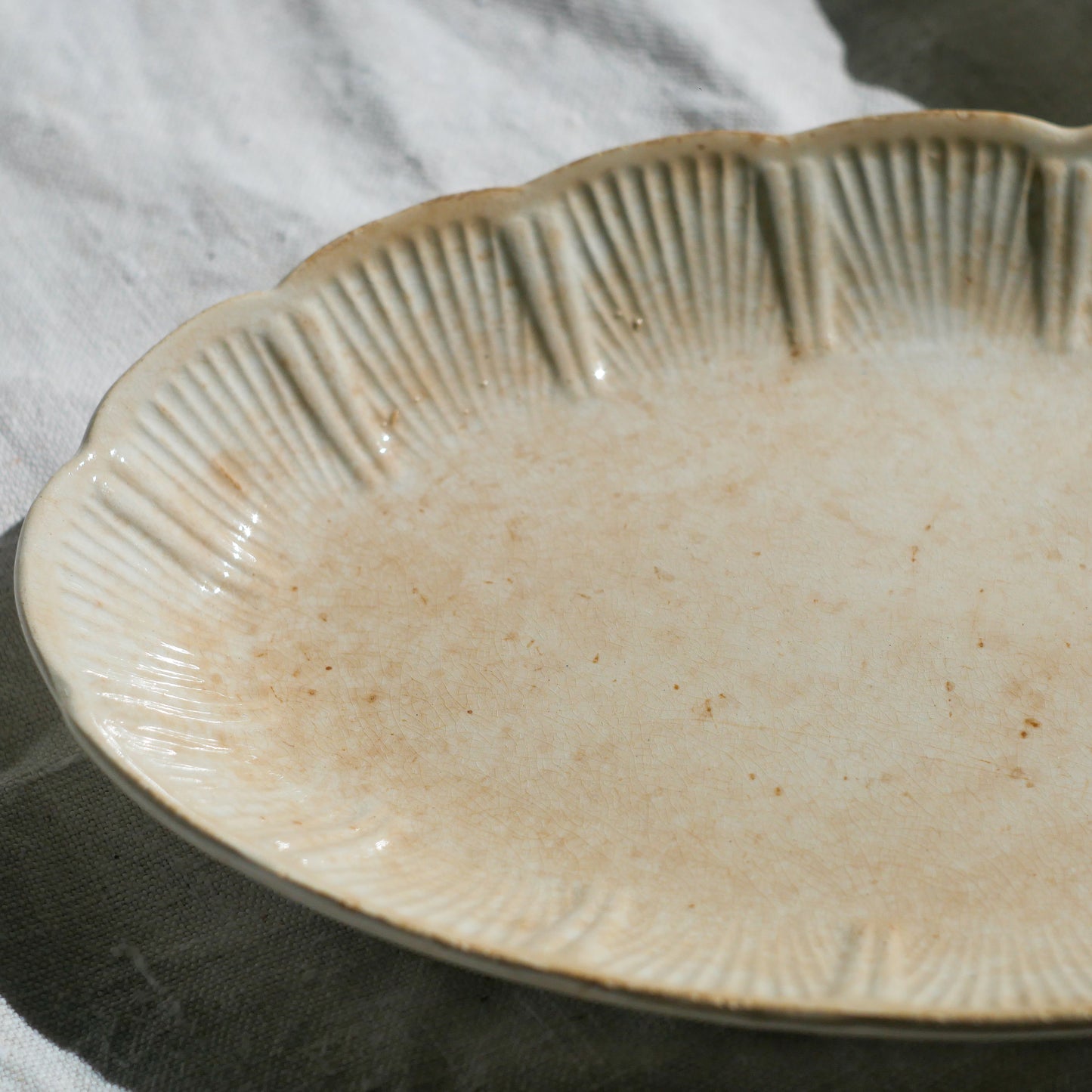 A beautiful pair of French antique ironstone raviers or side plates which over the last century or more have developed a wonderful time-worn and tea-stained finish which make them perfect for shabby chic interior decor. We very rarely come across these little plates lately they're a rare find.