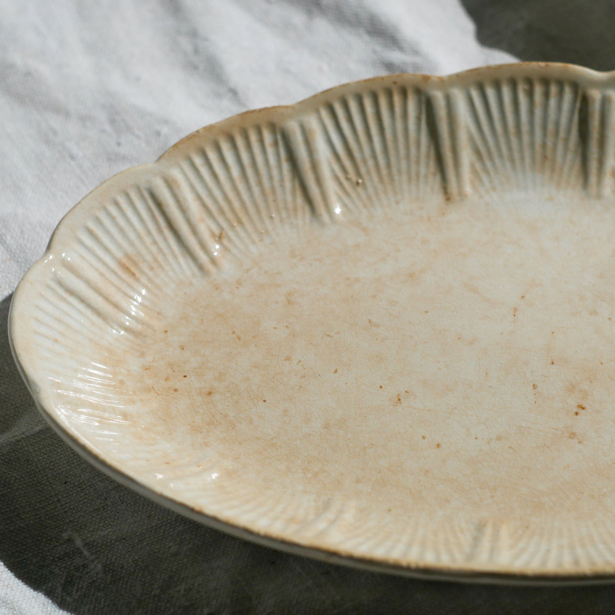 A beautiful pair of French antique ironstone raviers or side plates which over the last century or more have developed a wonderful time-worn and tea-stained finish which make them perfect for shabby chic interior decor. We very rarely come across these little plates lately they're a rare find.