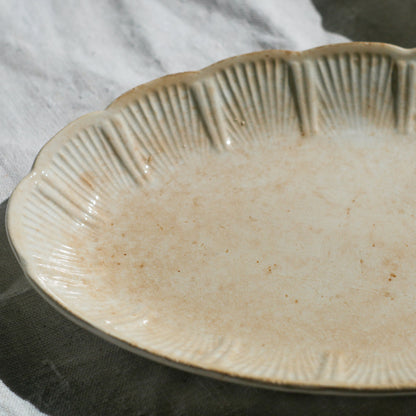 A beautiful pair of French antique ironstone raviers or side plates which over the last century or more have developed a wonderful time-worn and tea-stained finish which make them perfect for shabby chic interior decor. We very rarely come across these little plates lately they're a rare find.