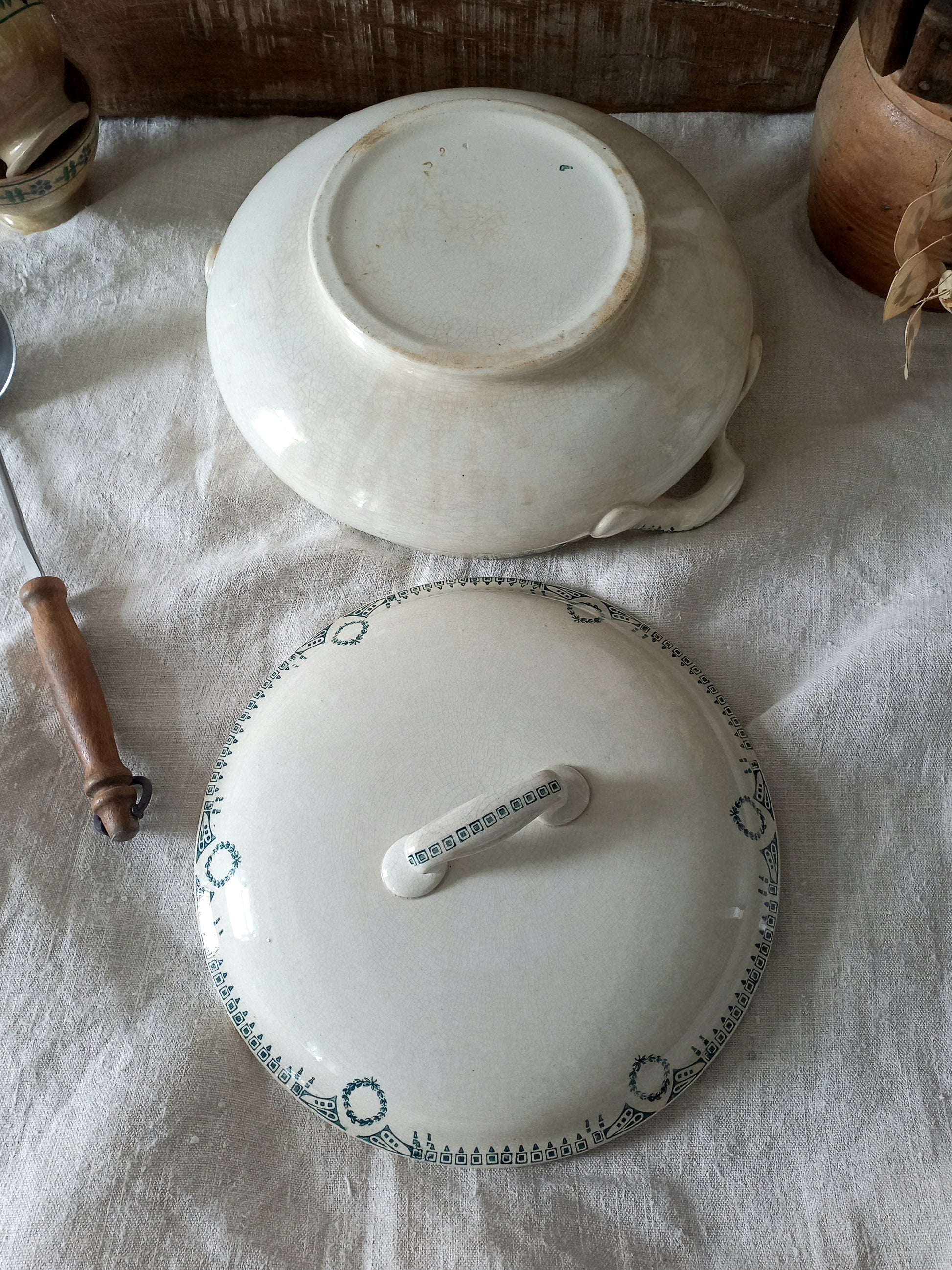A large French antique white ironstone soup tureen with an attractive teal colour transferware design. Over the many decades this lovely old tureen has developed a time-worn patina with a warm, creamy white finish.
