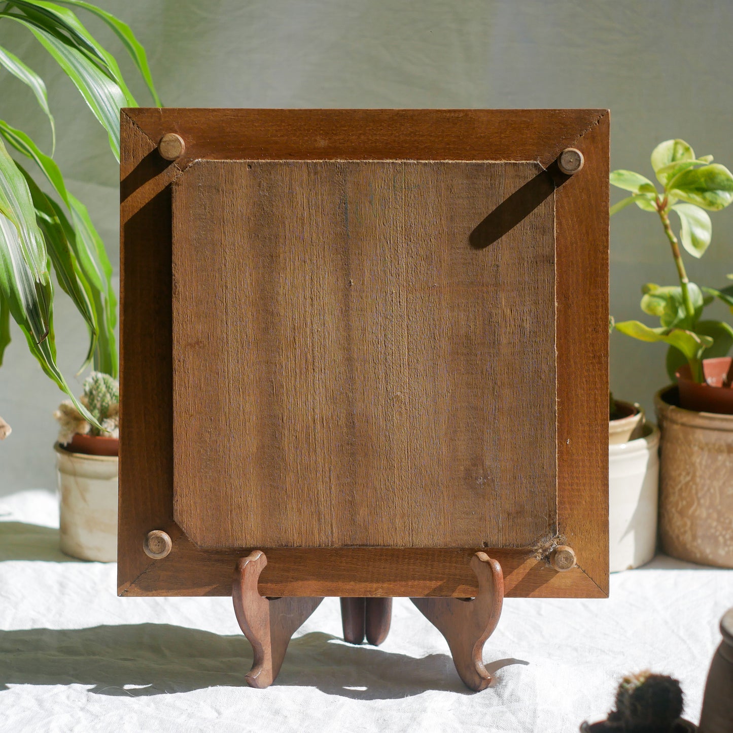 A beautiful French antique wooden trivet with a ceramic bird and floral tile insert. The wooden frame is very decorative with patterns around all four edges while the ceramic tile has aged just enough, the tasteful off-white and light brown colour scheme making this piece a most welcome addition to any kitchen as decor or perhaps as a decorative plant pot stand.