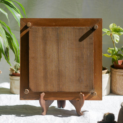 A beautiful French antique wooden trivet with a ceramic bird and floral tile insert. The wooden frame is very decorative with patterns around all four edges while the ceramic tile has aged just enough, the tasteful off-white and light brown colour scheme making this piece a most welcome addition to any kitchen as decor or perhaps as a decorative plant pot stand.