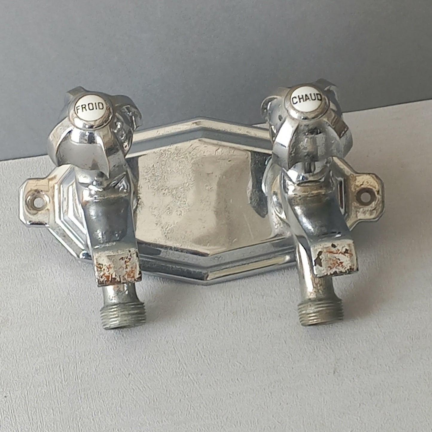 Stylish French vintage hot and cold faucet taps that are heavy, quality pieces probably dating from the 1930s time-frame. These old taps are being sold only as a restoration piece or project.