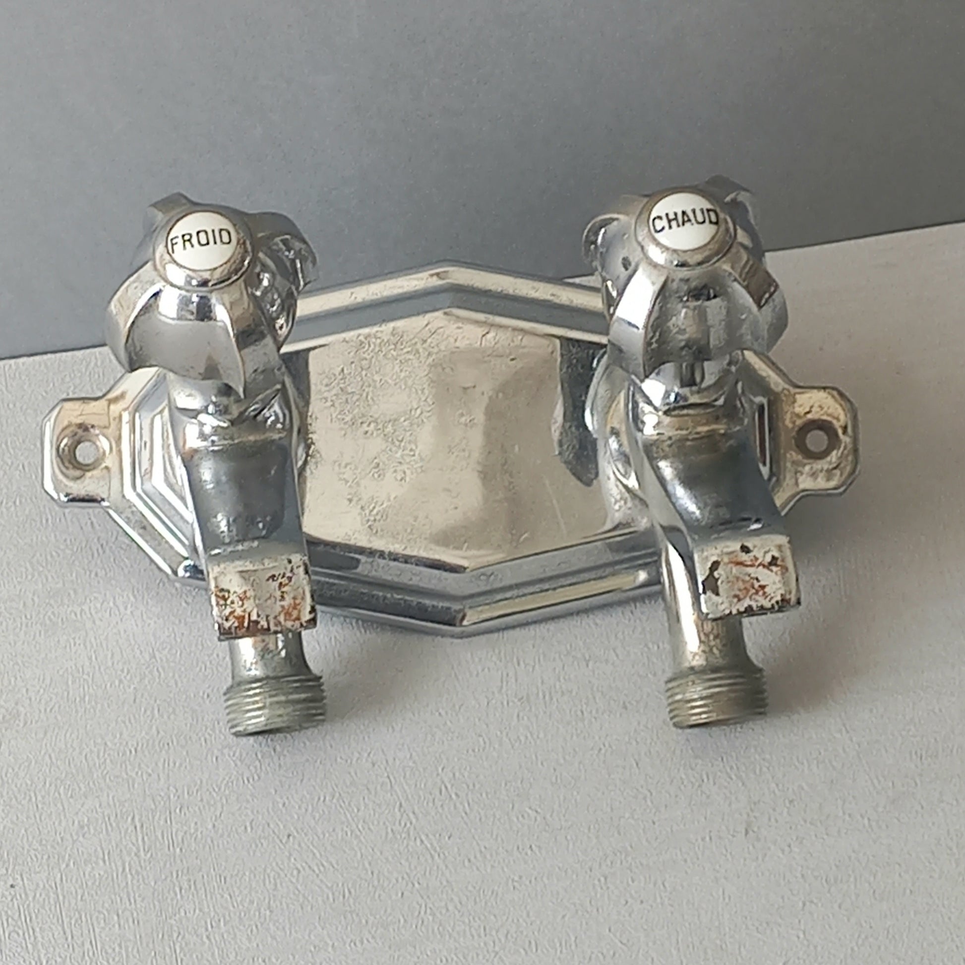 Stylish French vintage hot and cold faucet taps that are heavy, quality pieces probably dating from the 1930s time-frame. These old taps are being sold only as a restoration piece or project.