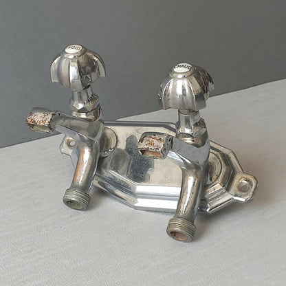 Stylish French vintage hot and cold faucet taps that are heavy, quality pieces probably dating from the 1930s time-frame. These old taps are being sold only as a restoration piece or project.