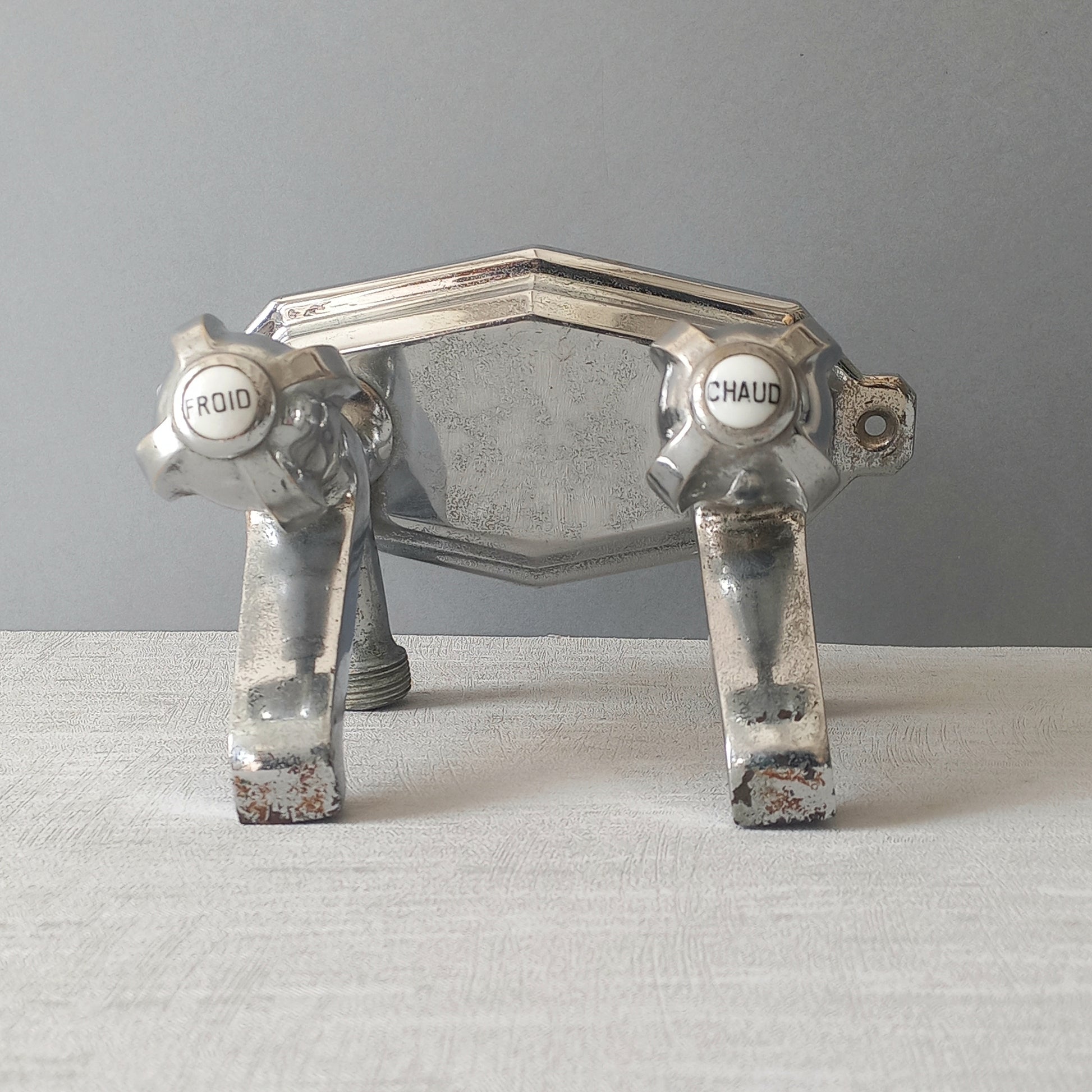 Stylish French vintage hot and cold faucet taps that are heavy, quality pieces probably dating from the 1930s time-frame. These old taps are being sold only as a restoration piece or project.