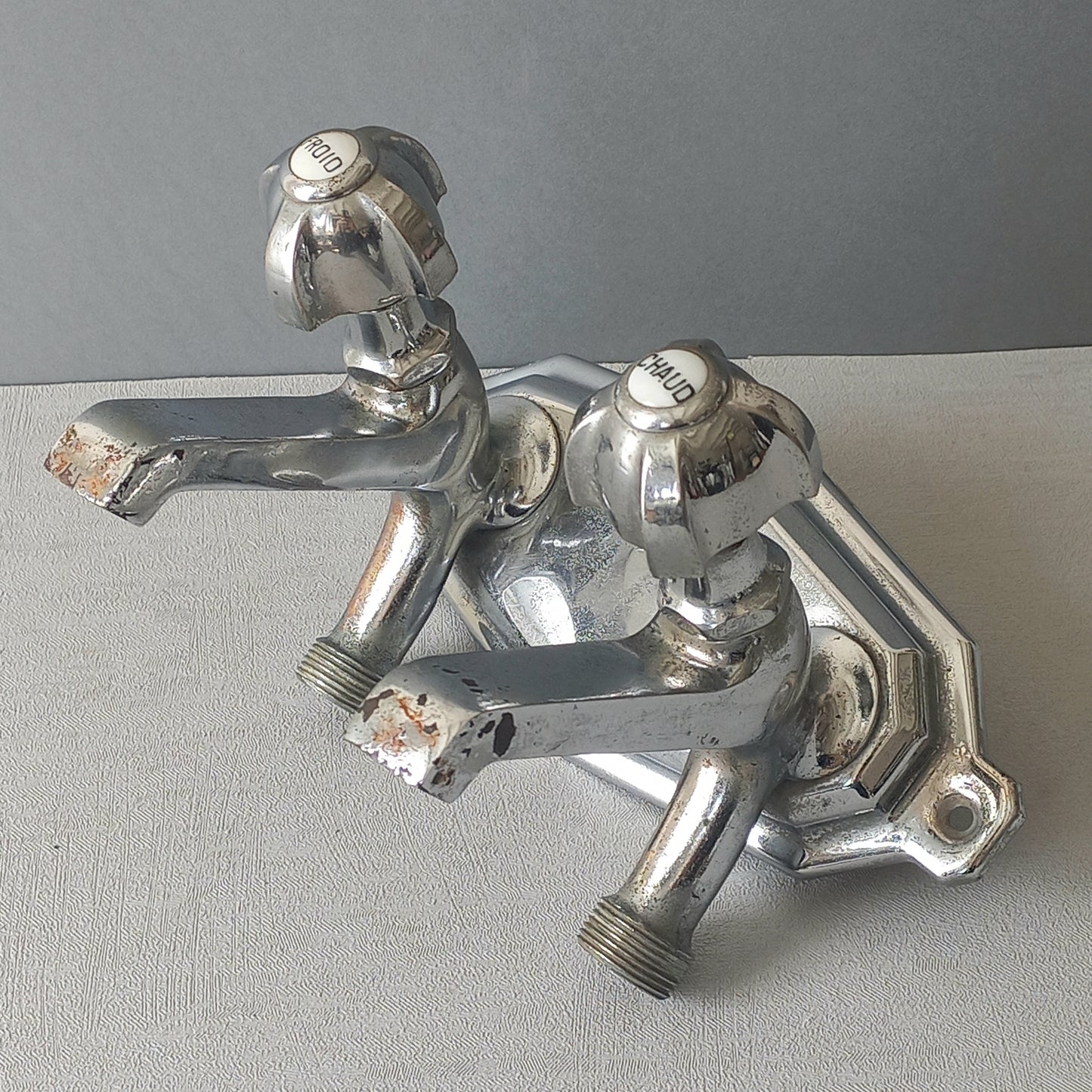 Stylish French vintage hot and cold faucet taps that are heavy, quality pieces probably dating from the 1930s time-frame. These old taps are being sold only as a restoration piece or project.