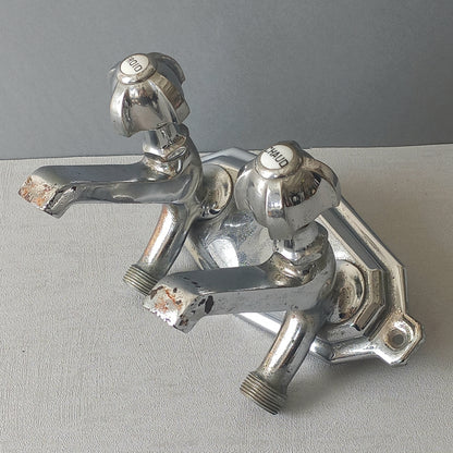 Stylish French vintage hot and cold faucet taps that are heavy, quality pieces probably dating from the 1930s time-frame. These old taps are being sold only as a restoration piece or project.