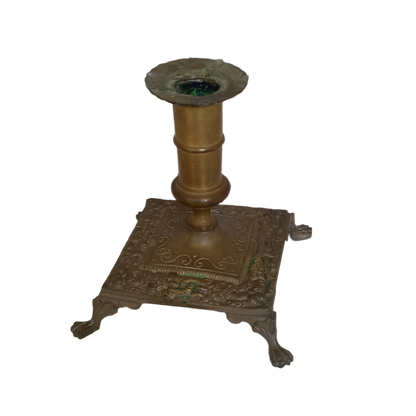 Small decorative antique candle stick holder with four little feet