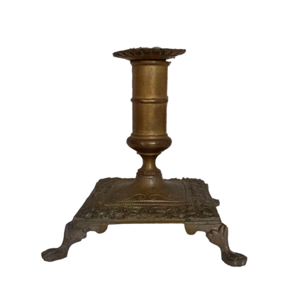 Small decorative antique candle stick holder with four little feet