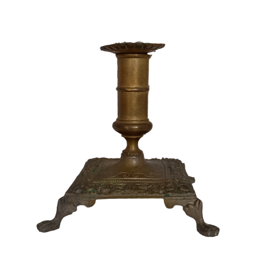 Small decorative antique candle stick holder with four little feet