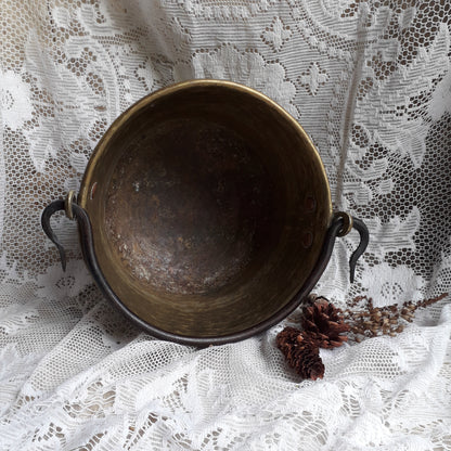A wonderful little French vintage/antique brass hanging cauldron with an iron handle, a quality piece with substantial weight for its size. This delightful piece was hand-made, the joins beneath clearly visible,which makes it all the more charming. It will make a super piece of home decor or a hanging planter.