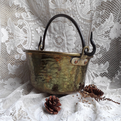 A wonderful little French vintage/antique brass hanging cauldron with an iron handle, a quality piece with substantial weight for its size. This delightful piece was hand-made, the joins beneath clearly visible,which makes it all the more charming. It will make a super piece of home decor or a hanging planter.
