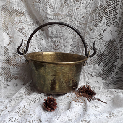 A wonderful little French vintage/antique brass hanging cauldron with an iron handle, a quality piece with substantial weight for its size. This delightful piece was hand-made, the joins beneath clearly visible,which makes it all the more charming. It will make a super piece of home decor or a hanging planter.