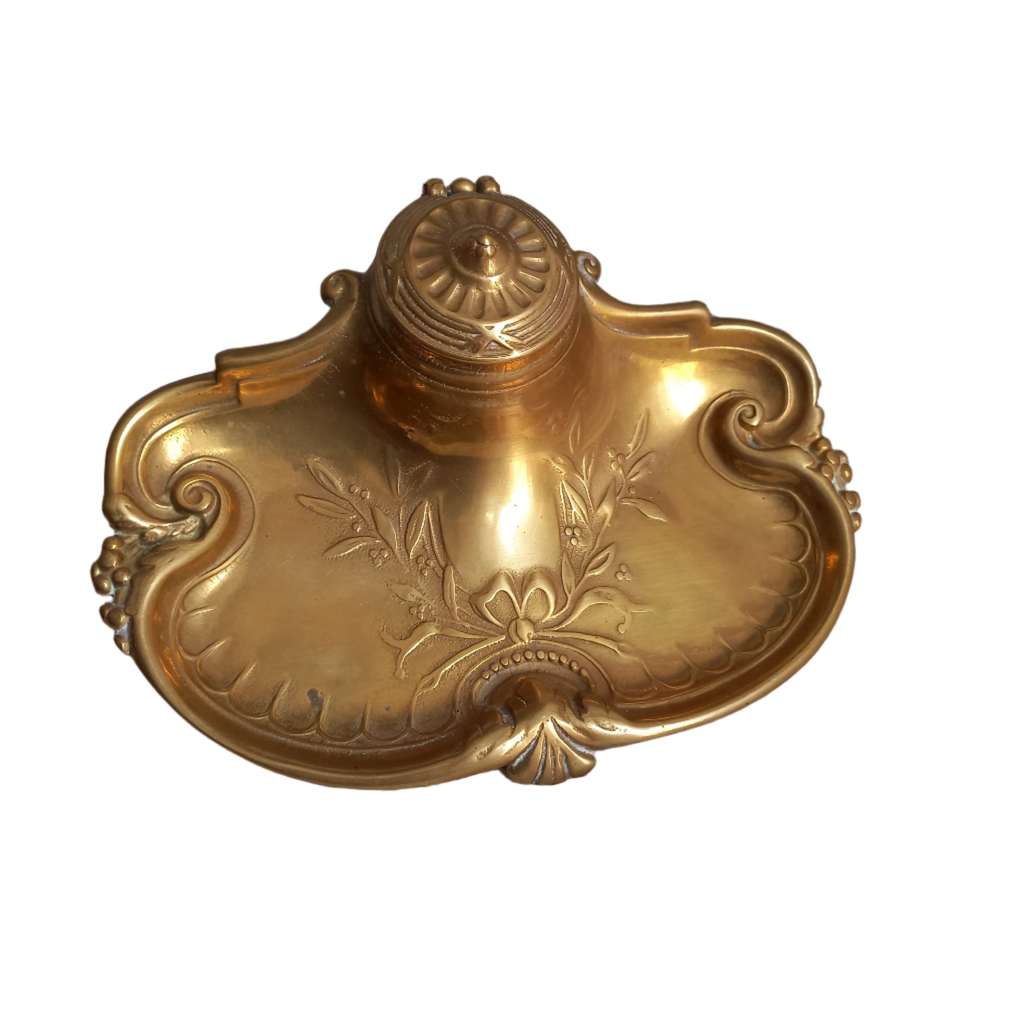 Decorative vintage brass inkwell with white porcelain ink cup