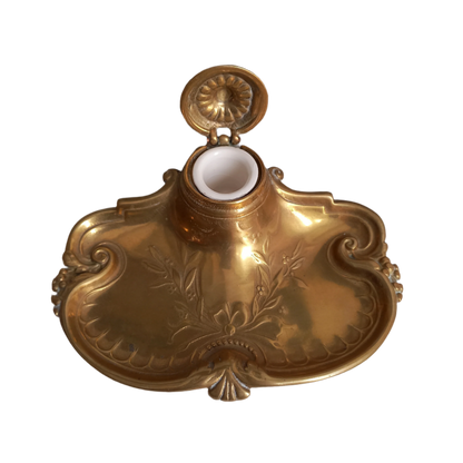 Decorative vintage brass inkwell with white porcelain ink cup