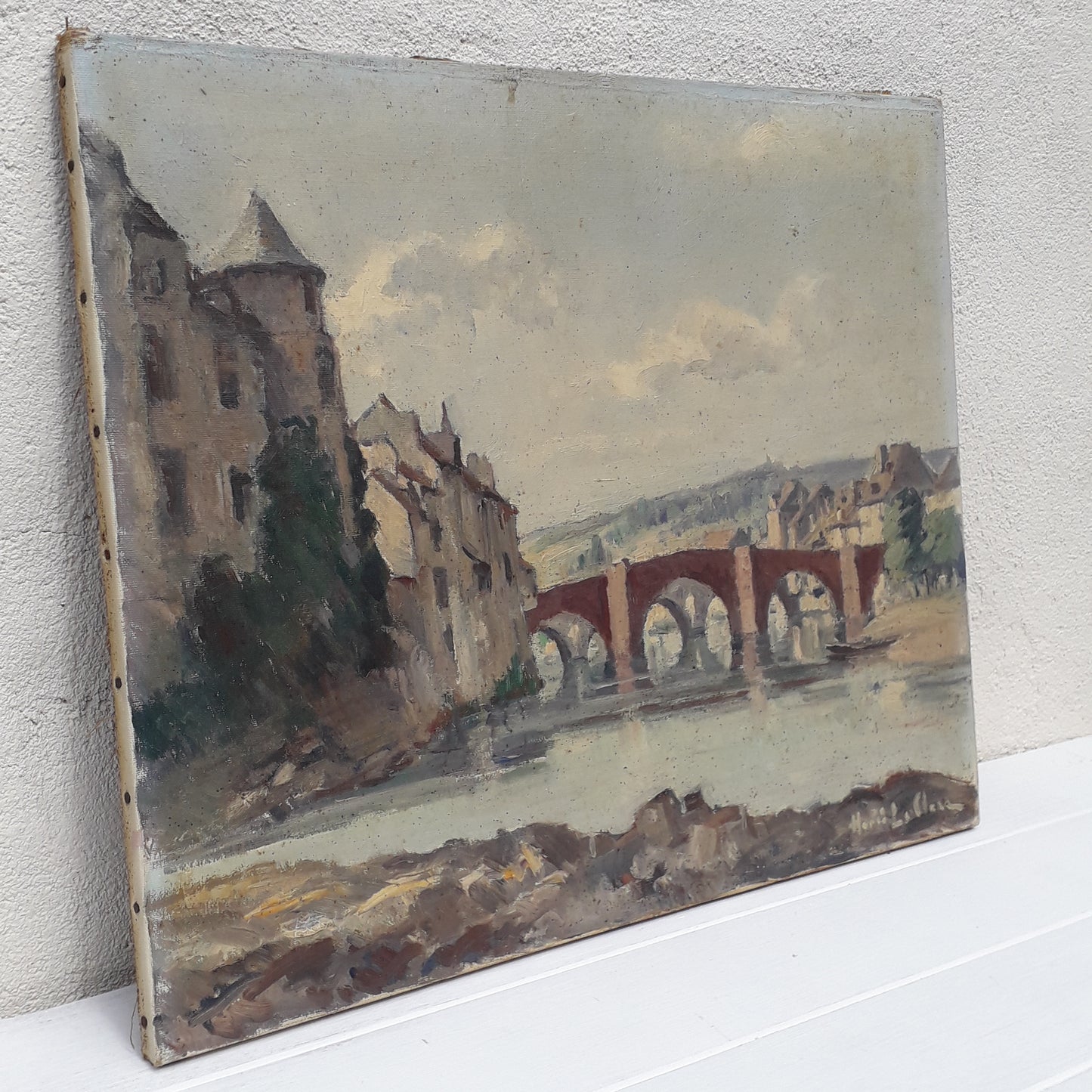 An exciting find and truly fabulous French vintage/antique oil painting depicting the old bridges of Espalion, Aveyron in France. The painting is signed Henri Le Clerc. Stretched canvas on wooden frame; to the rear on the wooden stretcher in very faded pencil is the location - my google search bought up a current view of this scene and little has changed. There is no date, although I guesstimate this painting to have been created in the early to mid 20th century.