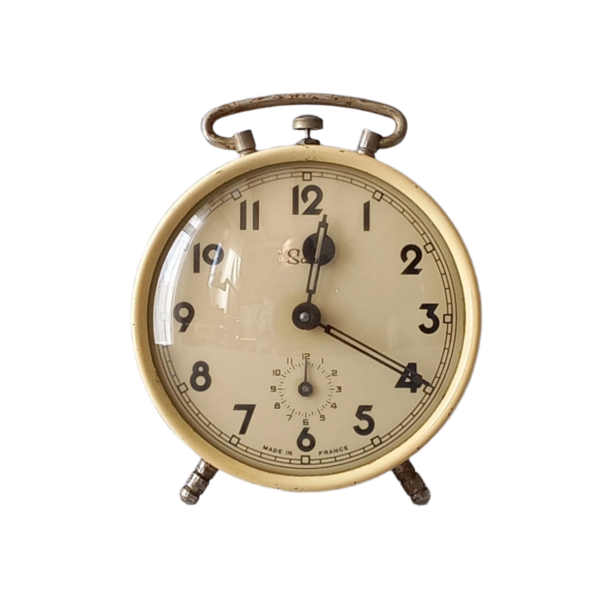 French vintage alarm clock with cream color case