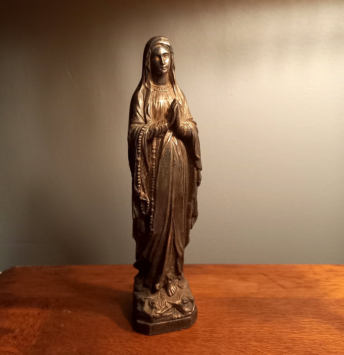 Small Virgin Mary religious figurine made from metal