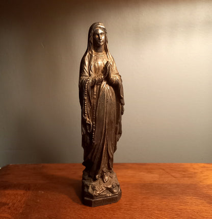 Small Virgin Mary religious figurine made from metal
