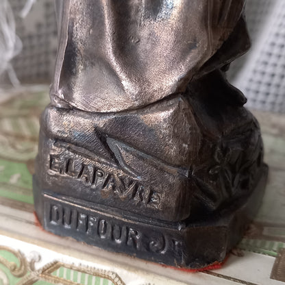 Small Virgin Mary religious figurine made from metal