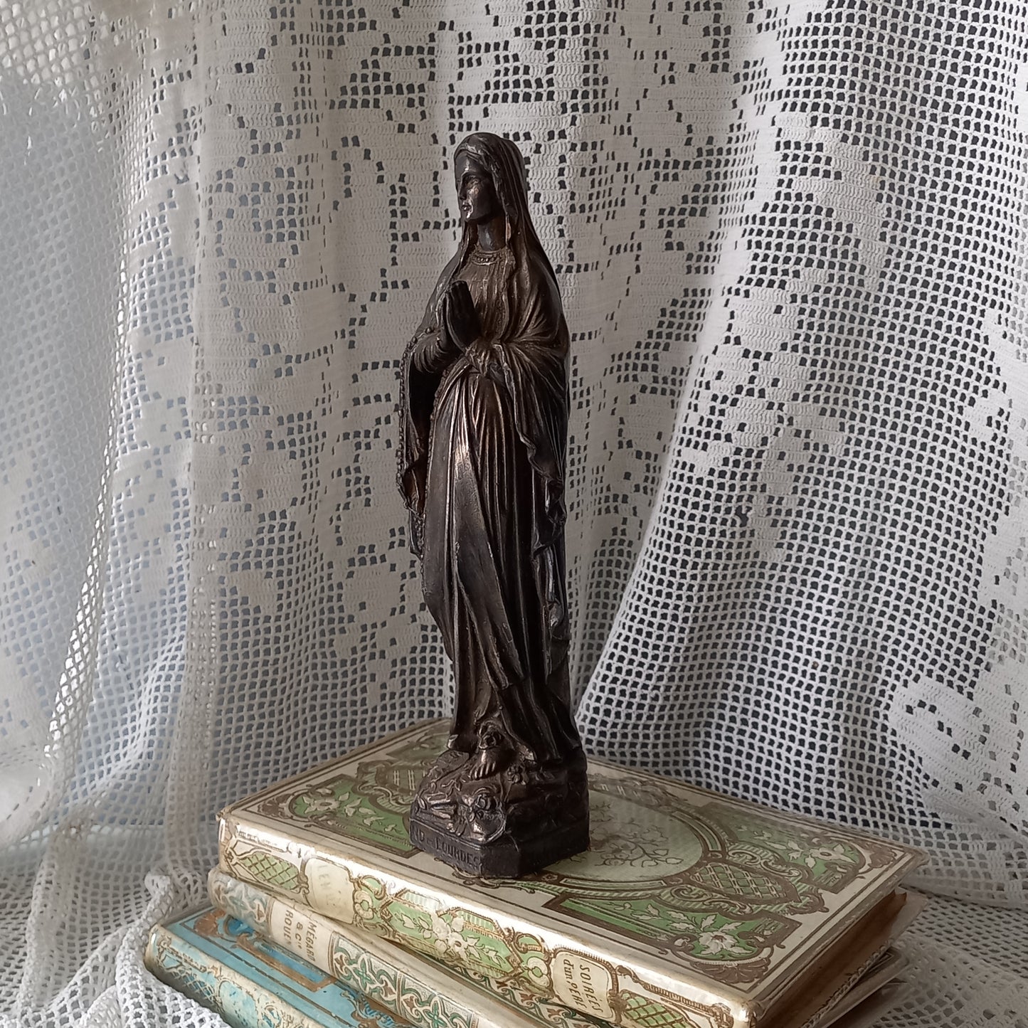 Small Virgin Mary religious figurine made from metal