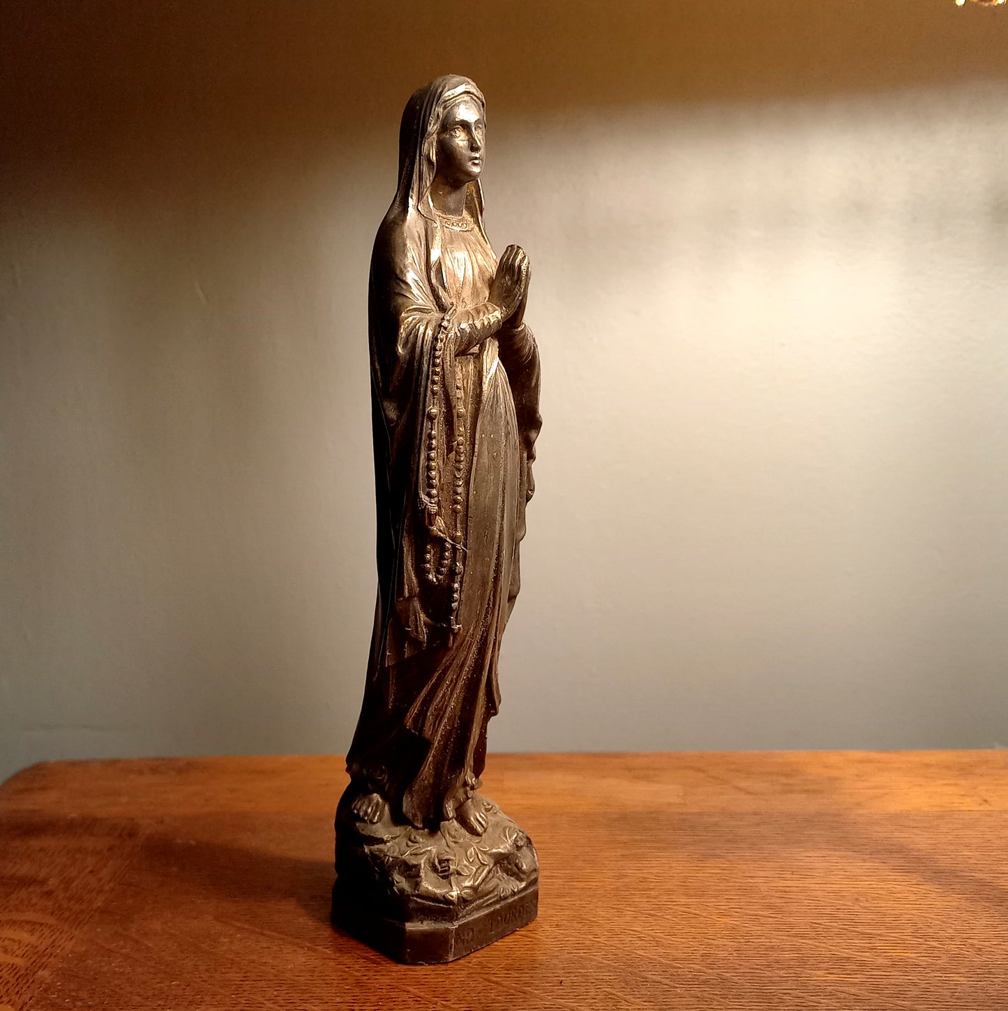 Small Virgin Mary religious figurine made from metal
