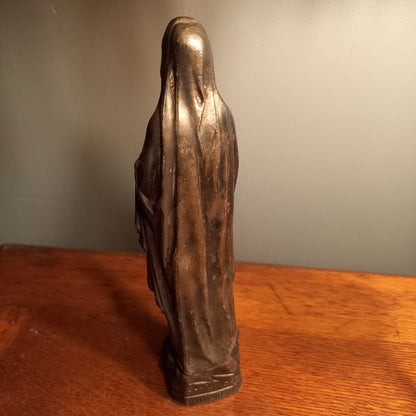 Small Virgin Mary religious figurine made from metal