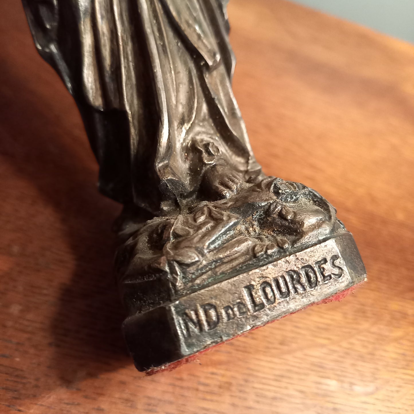 Small Virgin Mary religious figurine made from metal