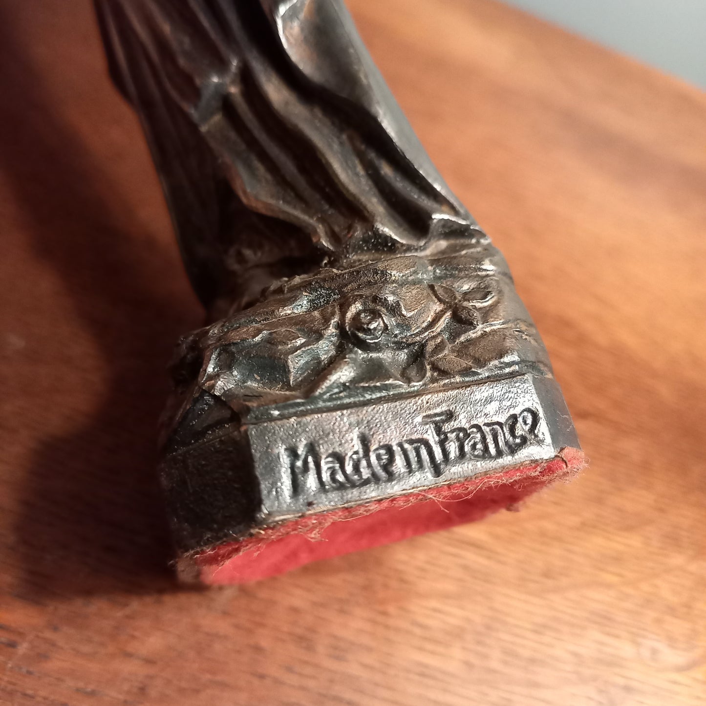 Small Virgin Mary religious figurine made from metal