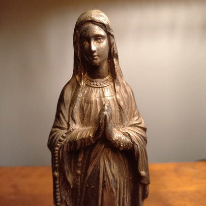 Small Virgin Mary religious figurine made from metal