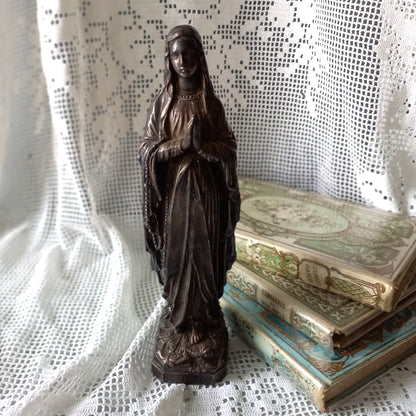 Small Virgin Mary religious figurine made from metal