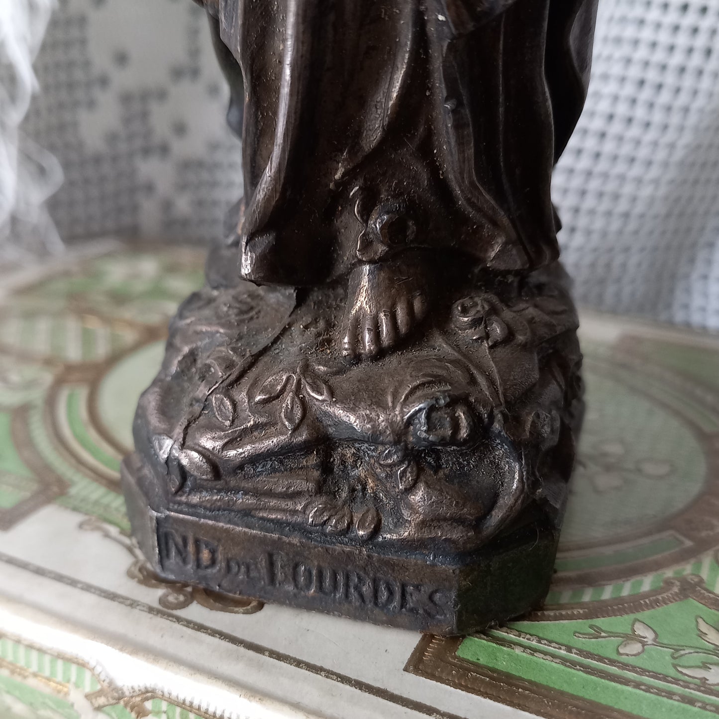 Small Virgin Mary religious figurine made from metal