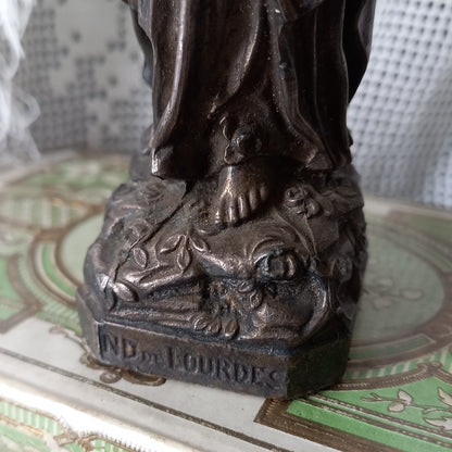 Small Virgin Mary religious figurine made from metal
