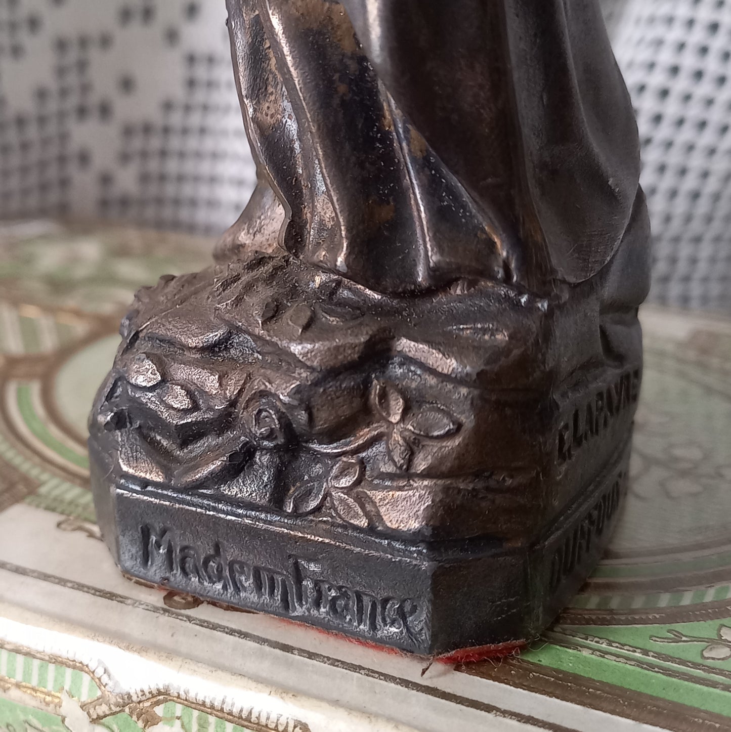 Small Virgin Mary religious figurine made from metal