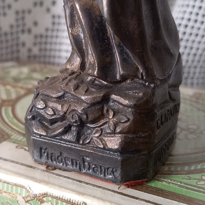 Small Virgin Mary religious figurine made from metal