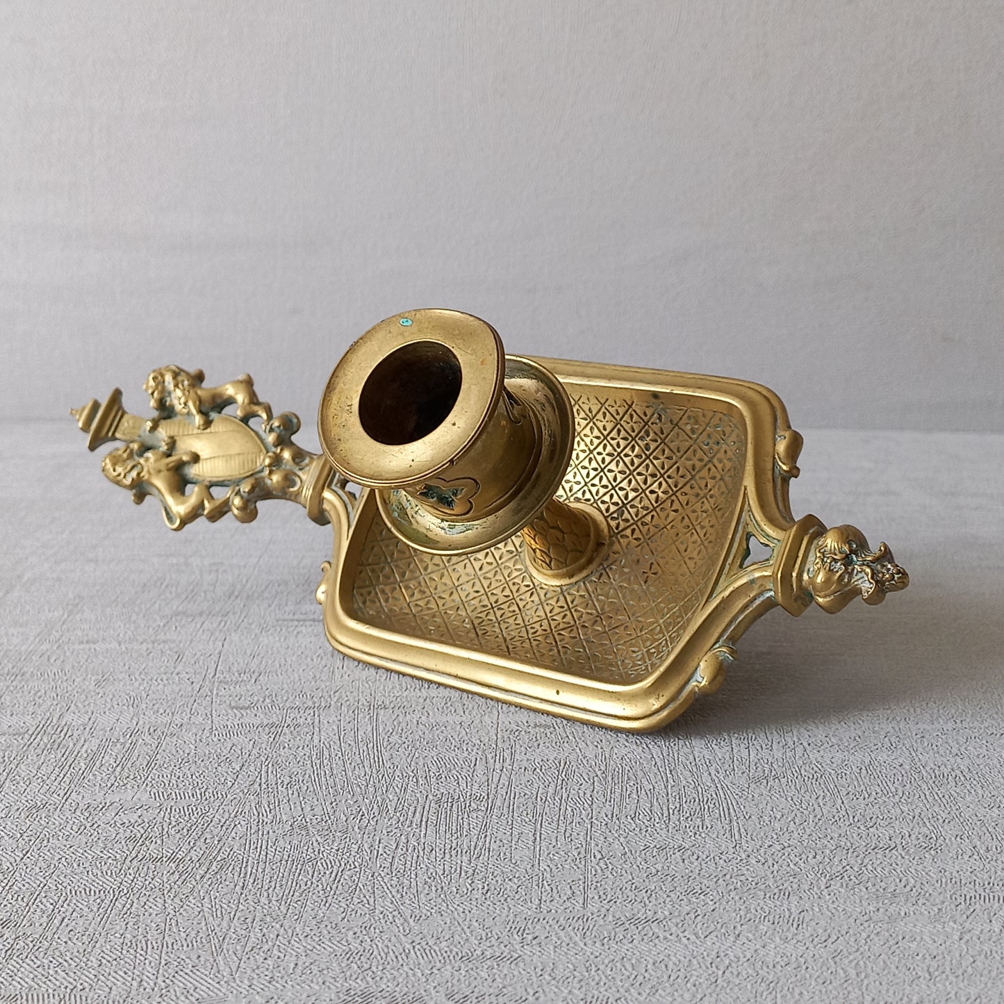 A French antique bronze/brass candle holder or chamber stick, a quality piece that is highly detailed with engraved patterns and a coat of arms with two lovely lions on the handle! This is a heavy piece for its small size and will make super home decor in any interior.