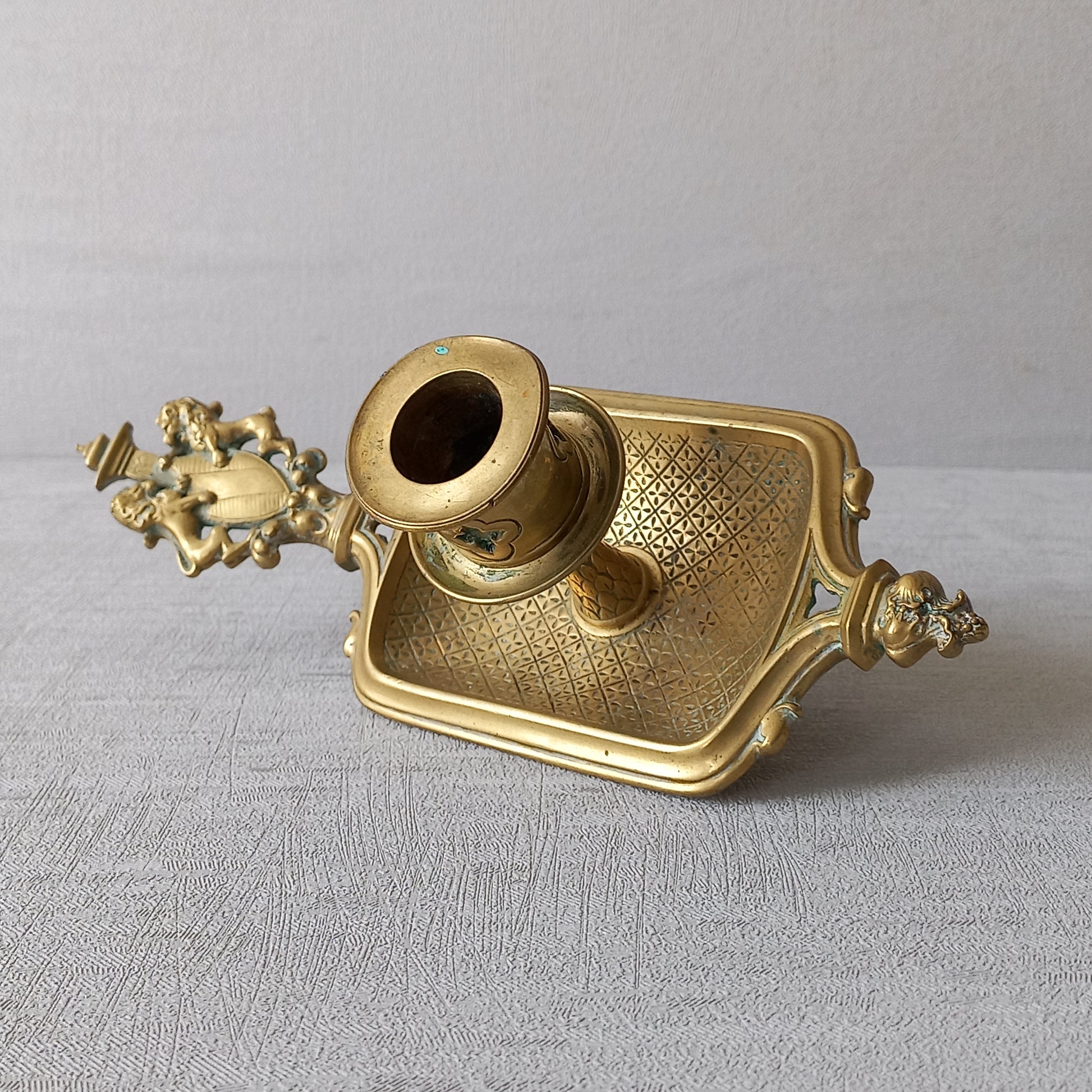 A French antique bronze/brass candle holder or chamber stick, a quality piece that is highly detailed with engraved patterns and a coat of arms with two lovely lions on the handle! This is a heavy piece for its small size and will make super home decor in any interior.