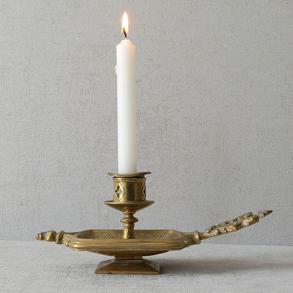 A French antique bronze/brass candle holder or chamber stick, a quality piece that is highly detailed with engraved patterns and a coat of arms with two lovely lions on the handle! This is a heavy piece for its small size and will make super home decor in any interior.