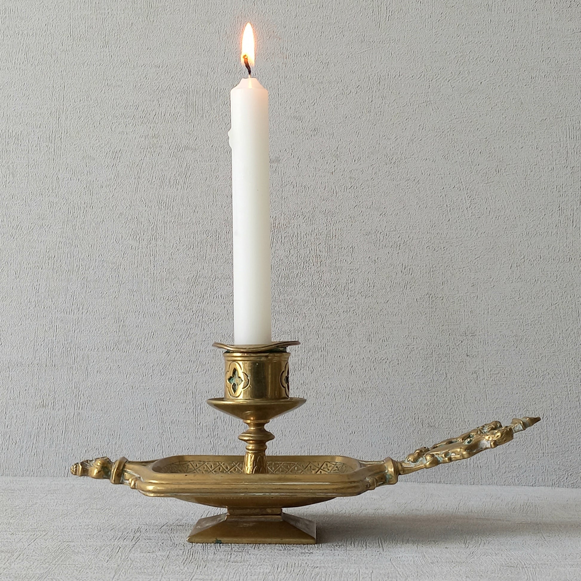 A French antique bronze/brass candle holder or chamber stick, a quality piece that is highly detailed with engraved patterns and a coat of arms with two lovely lions on the handle! This is a heavy piece for its small size and will make super home decor in any interior.